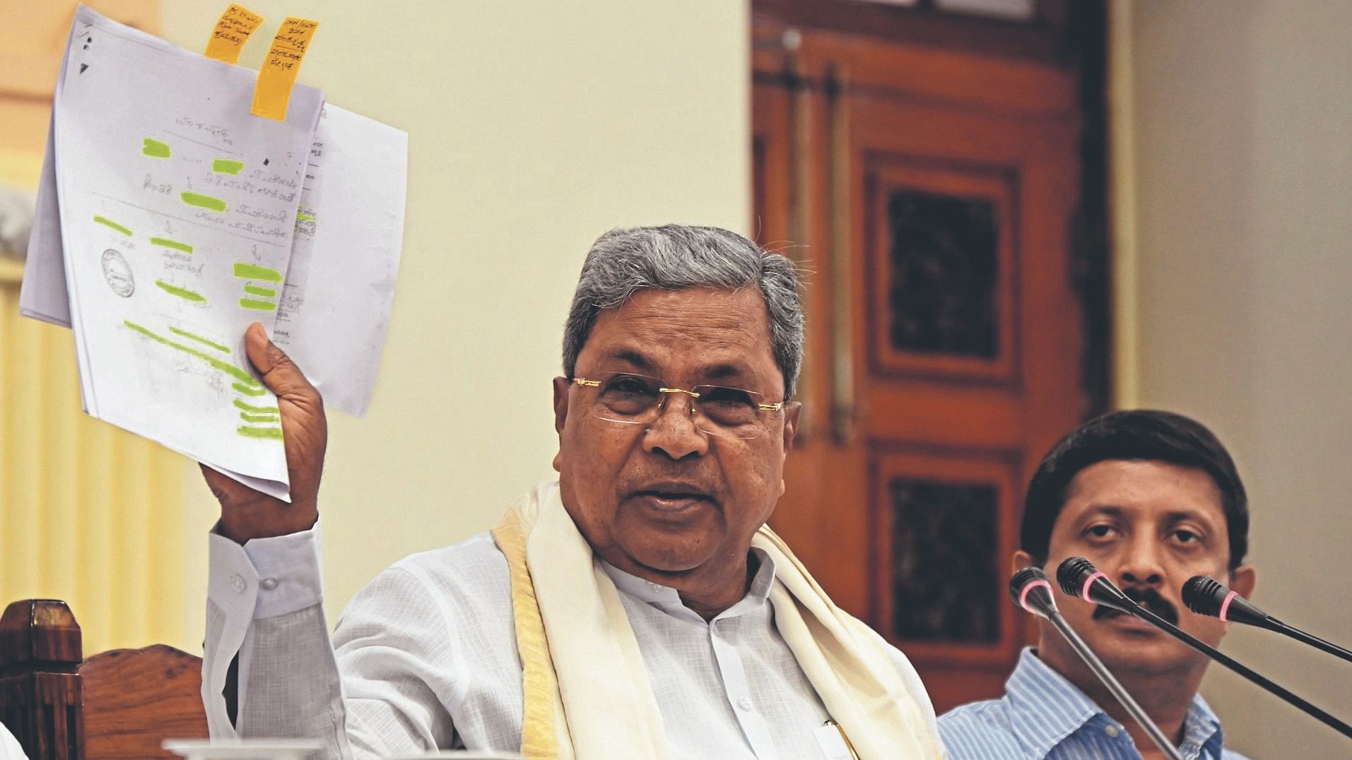 <div class="paragraphs"><p>Chief Minister Siddaramaiah displaying the doccuments at a press conference about MUDA allegation at Vidhana Soudha in Bengaluru on Friday.</p></div>